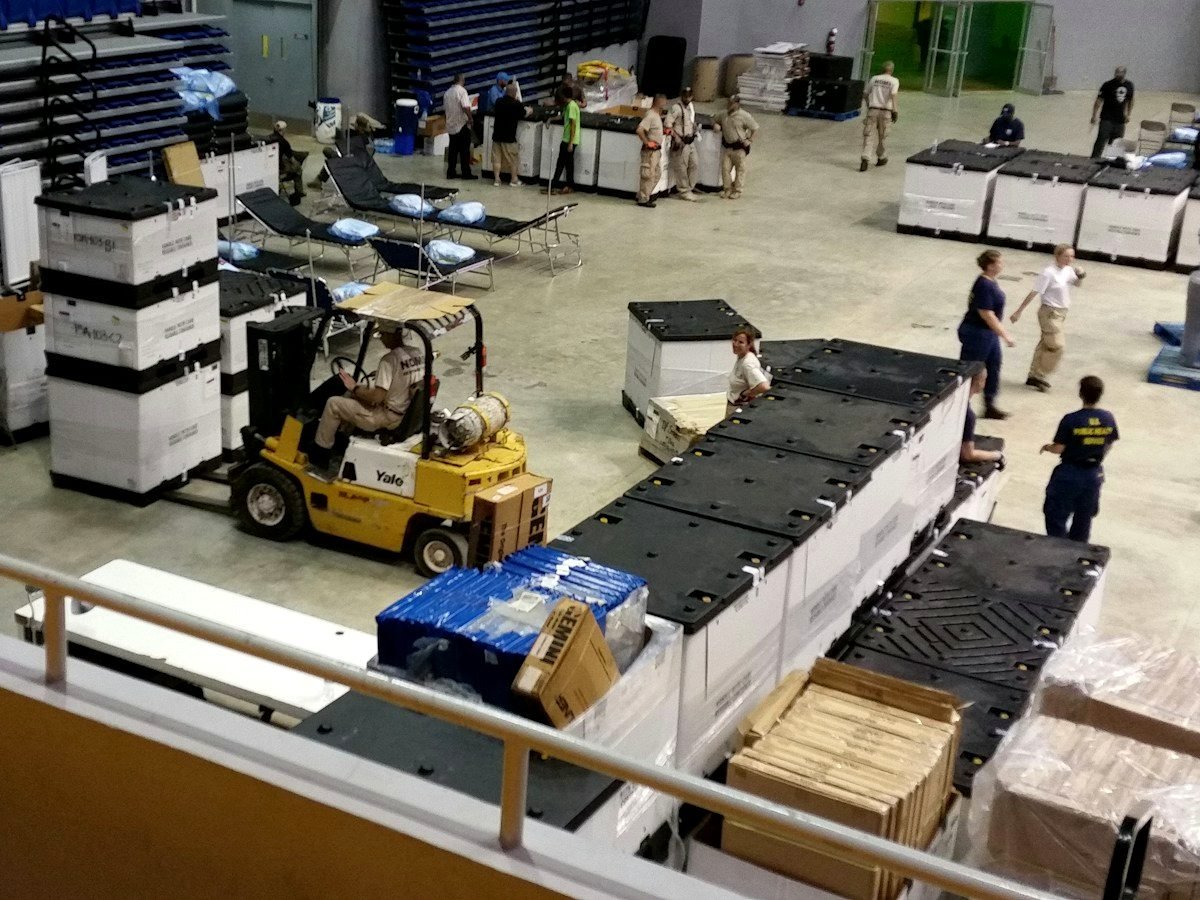 Crates of graded produce staged inside an Elmarota packhouse